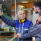 Professional training new workers in factory