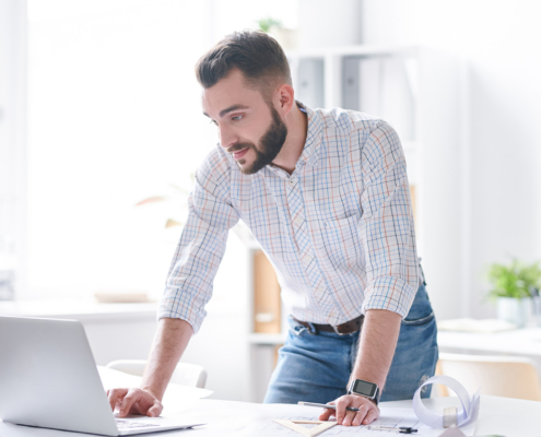 Side view of a man on laptop